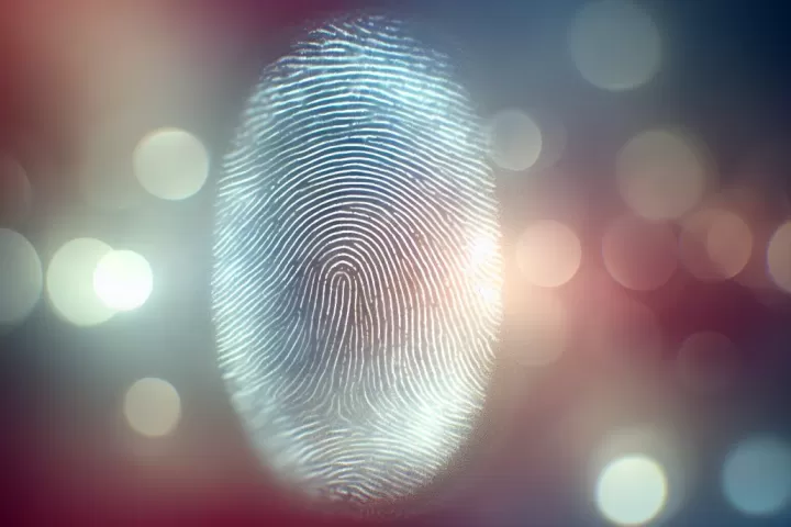 A dreamlike close-up of fingertips with fading fingerprints, symbolising identity loss, uncertainty, and emotional change.